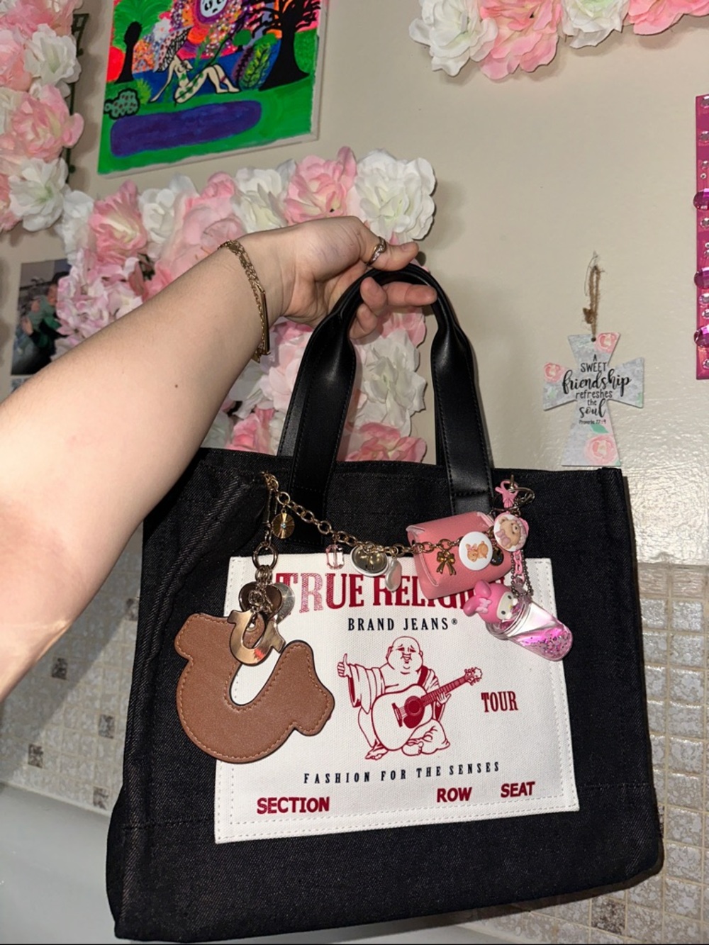 True Religion Black Canvas Tote with Brown Charm and Pink Accents